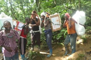 Community Health Workers Transporting drugs by head to remote inaccessible health facilities